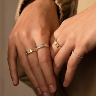 Handcrafted channel set diamond ring with graduated baguette stones, offering a timeless and sophisticated look.