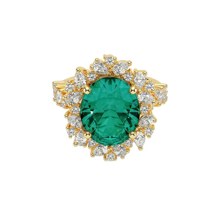 Olivetta cocktail ring with oval lab-grown emerald and round diamond floral halo in 18k yellow gold by Brilliant Earth