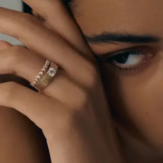 Modern ribbed gold ring with half-carat round diamond – statement engagement ring design