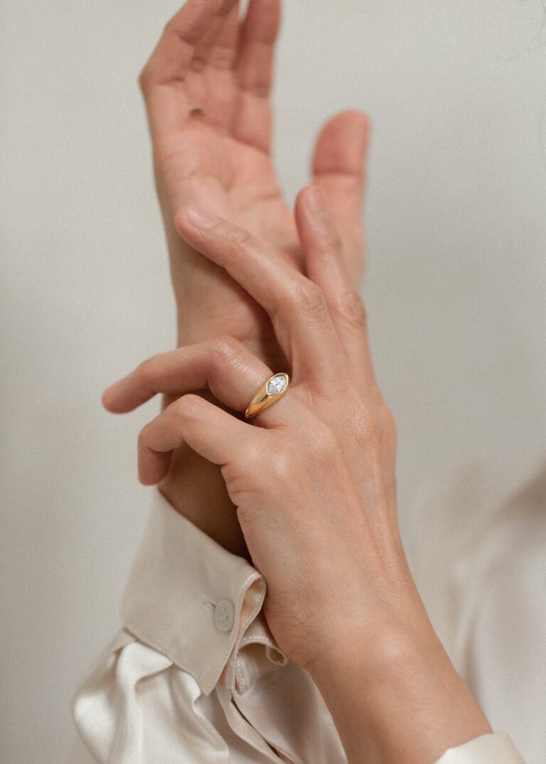 Kinn Studio Eloise ring in 14K solid gold, marquise diamond flush‑burnish set in signet style