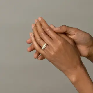 Five Triangle Ring by Mociun, showcasing white opal cabochons and white diamonds in a unique setting.