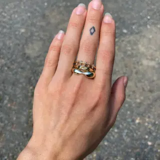 Yellow Sapphire Petite Risa Ring by M. Hisae featuring a 0.35ct oval yellow sapphire in a tapered 14k recycled gold band.