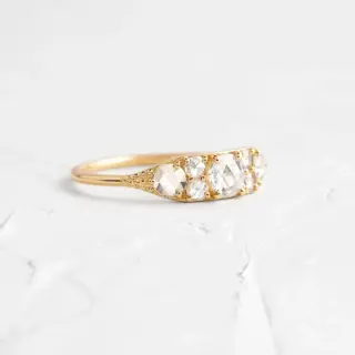 Overture Ring by Melanie Casey: Seven rose cut diamonds set in a tapered 14k gold band, showcasing vintage-inspired elegance
