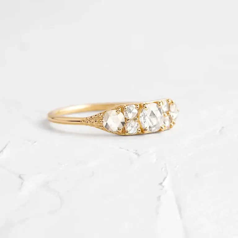 Overture Ring by Melanie Casey: Seven rose cut diamonds set in a tapered 14k gold band, showcasing vintage-inspired elegance