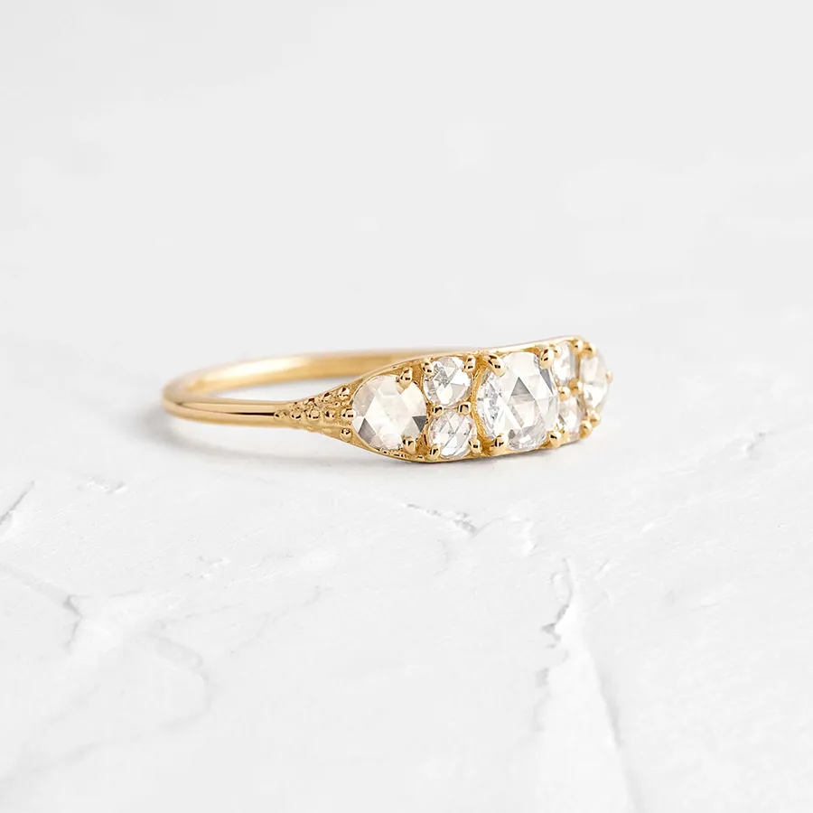 Overture Ring by Melanie Casey: Seven rose cut diamonds set in a tapered 14k gold band, showcasing vintage-inspired elegance