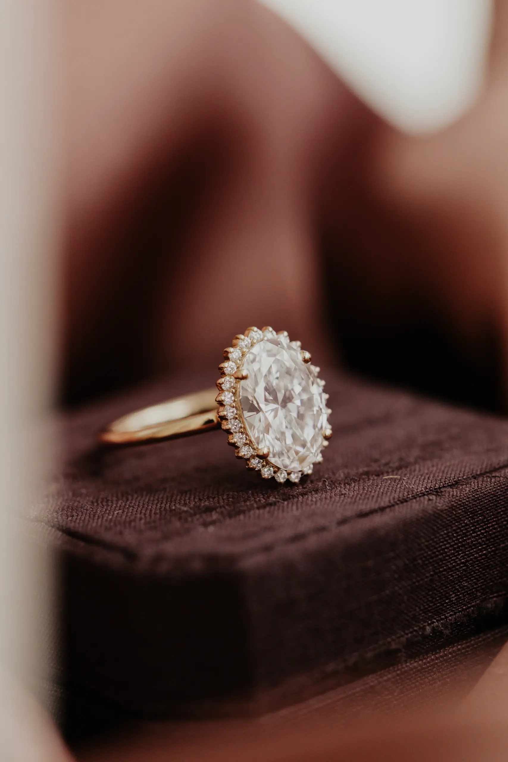 Handcrafted Nova Oval Ring from Sarah O. Jewelry, featuring a 1.0ct lab-grown oval diamond with a diamond halo in 14k rose gold.