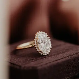 Handcrafted Nova Oval Ring from Sarah O. Jewelry, featuring a 1.0ct lab-grown oval diamond with a diamond halo in 14k rose gold.