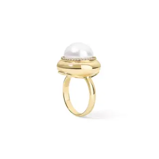 Lifestyle image of the Large Candy Button Pearl Ring by Stephanie Gottlieb worn on the hand, paired with matching pearl jewelry