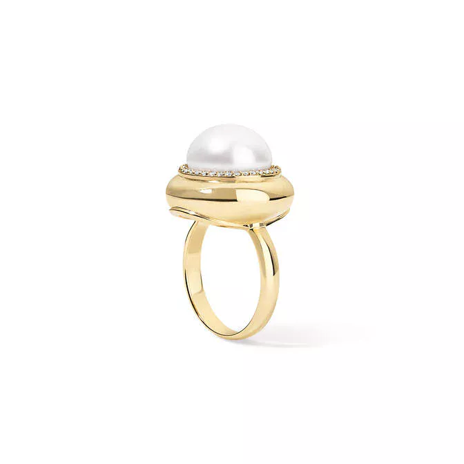 Lifestyle image of the Large Candy Button Pearl Ring by Stephanie Gottlieb worn on the hand, paired with matching pearl jewelry