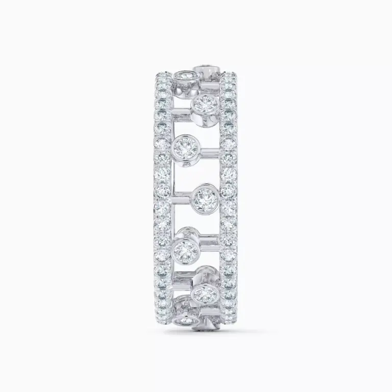 Close-up of De Beers Dewdrop ring showcasing intricate pavé and bezel diamond arrangement in white gold