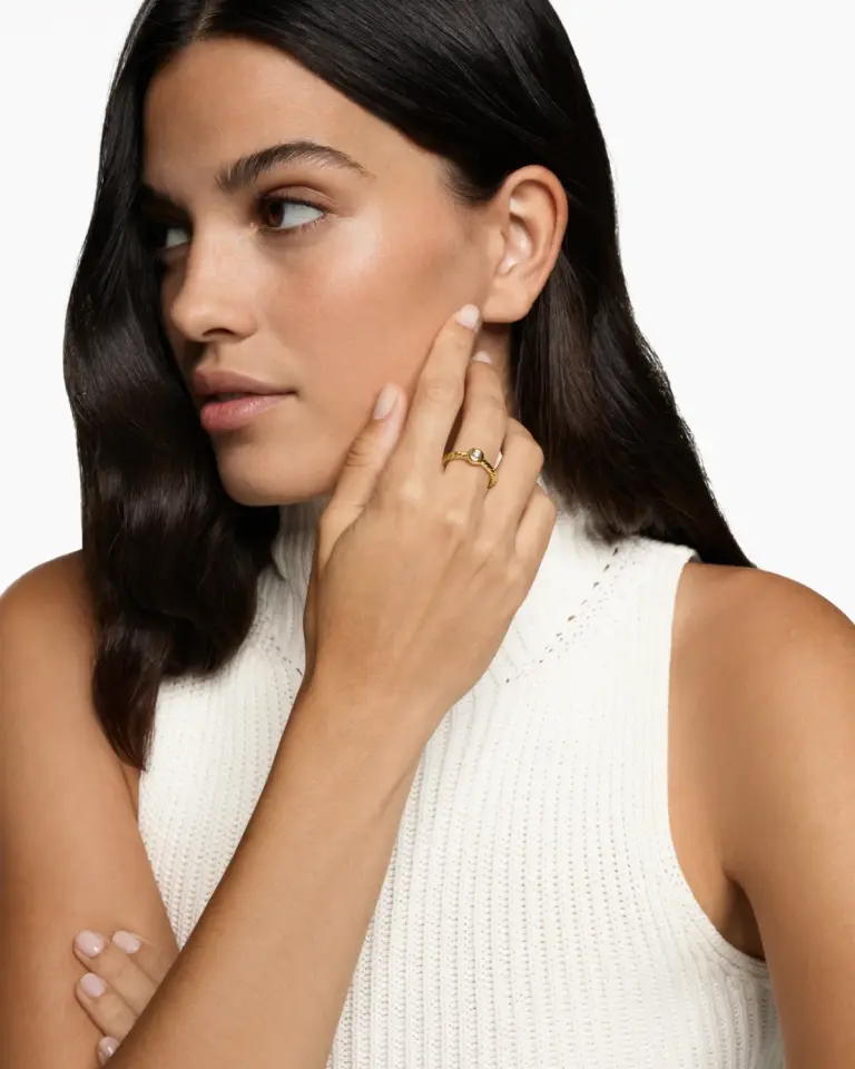 Close-up of the Petite Cable Ring, highlighting the 2.8mm diamond and the intricate twisted cable design in 18K yellow gold.