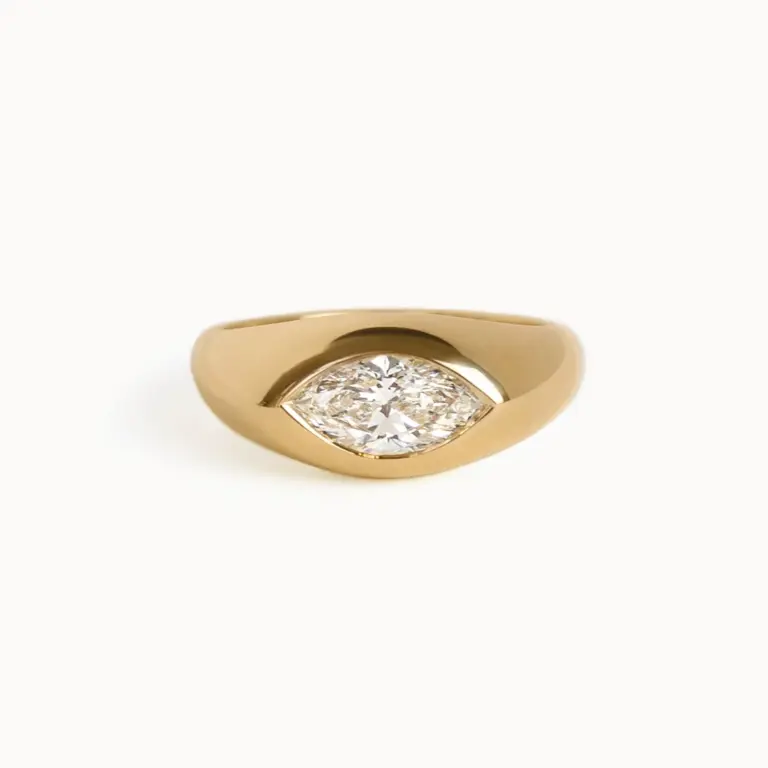 The Eloise engagement ring by Kinn Studio: 14K gold band with flush‑set marquise diamond