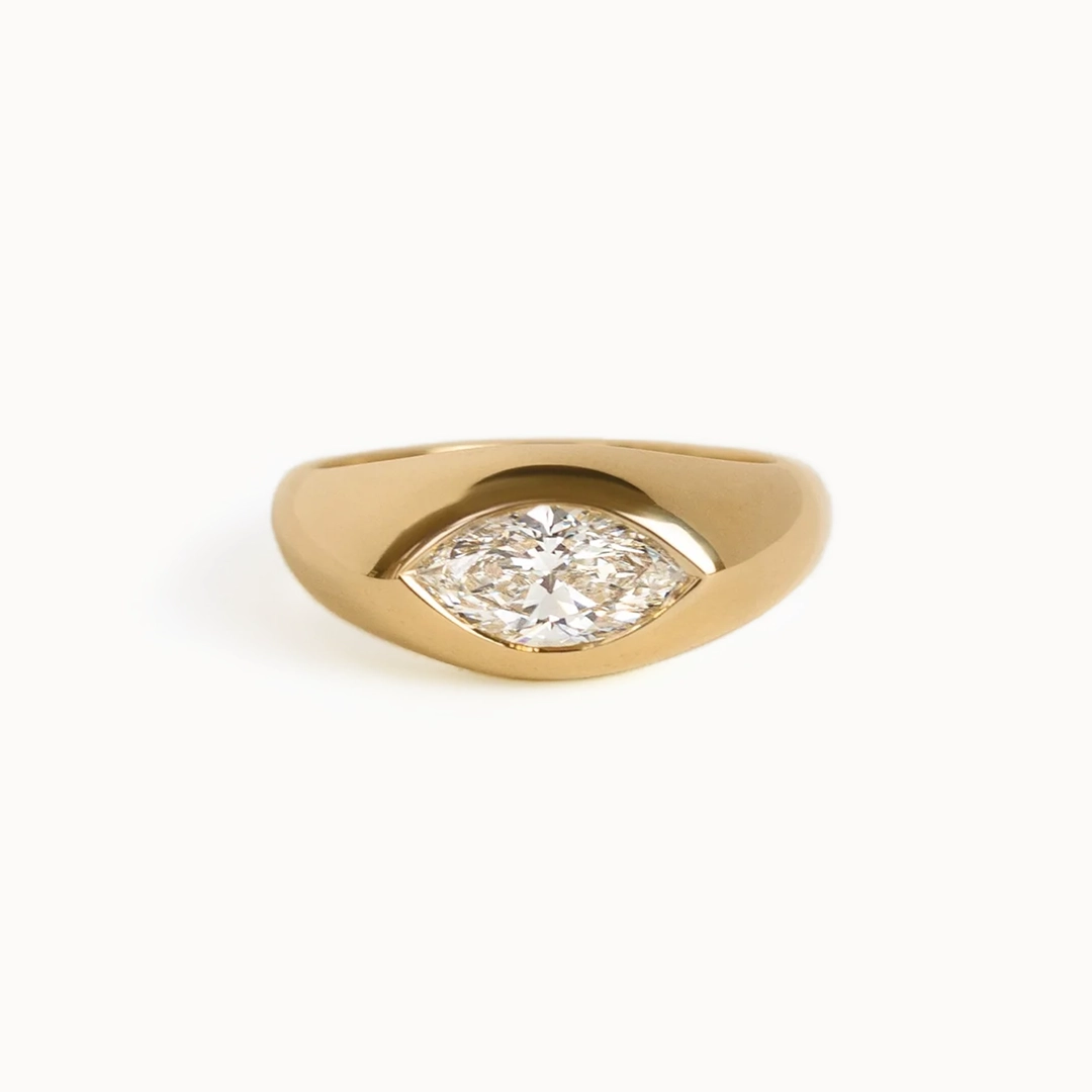 The Eloise engagement ring by Kinn Studio: 14K gold band with flush‑set marquise diamond