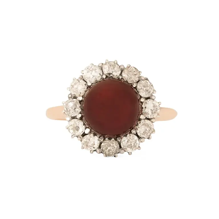 Antique Victorian cluster ring in sterling silver and 10k yellow gold with a 9 mm garnet cabochon center and a halo of 12 chunky Old‑Mine‑cut diamonds (~1.08 ct total)