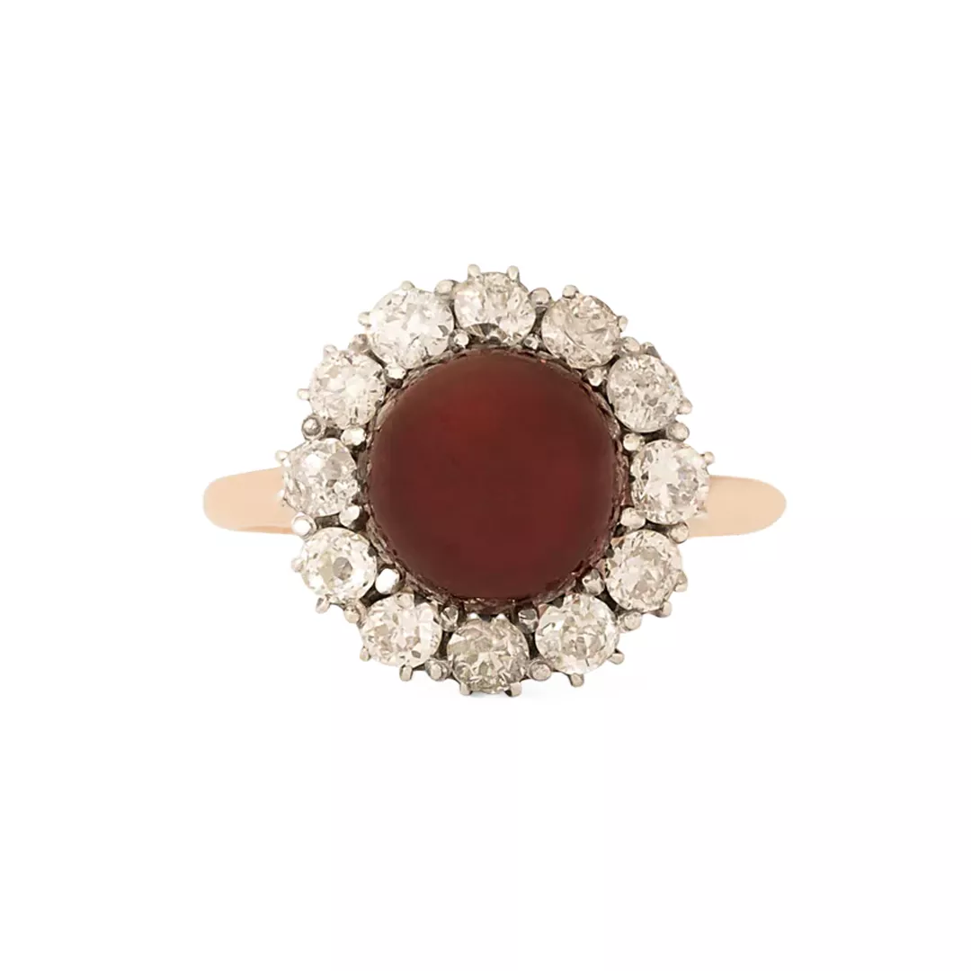 Antique Victorian cluster ring in sterling silver and 10k yellow gold with a 9 mm garnet cabochon center and a halo of 12 chunky Old‑Mine‑cut diamonds (~1.08 ct total)