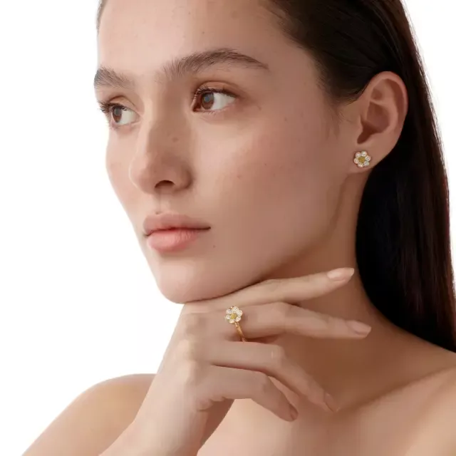 18K yellow gold Diamond Fiori Ring shown on hand, highlighting delicate design and elegant sparkle of surrounding diamonds