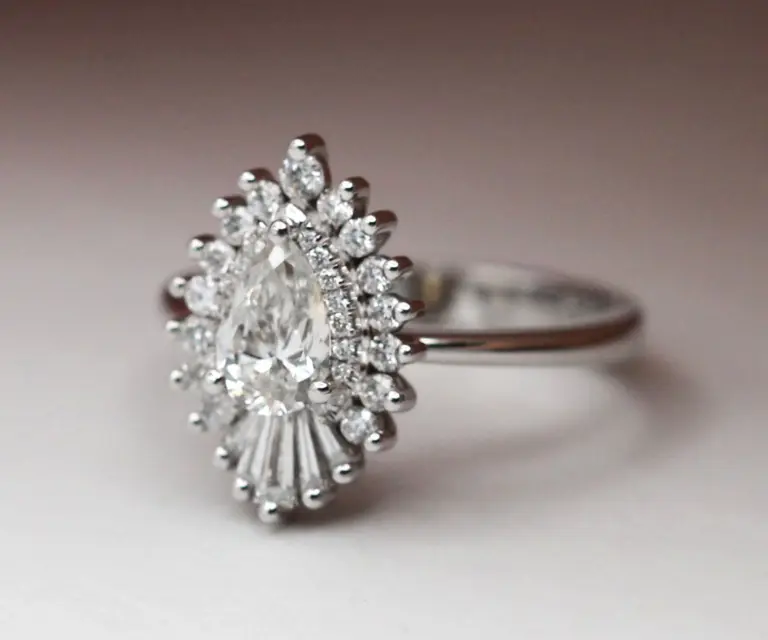 Side view of the Rhapsody 15mm ring, emphasizing the detailed band and diamond halo surrounding the central GIA-certified diamond.