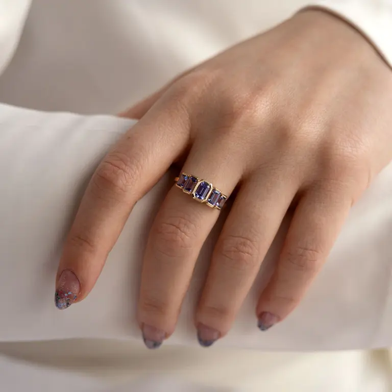 Handcrafted Juno Ring with five indigo blue emerald-cut tanzanites in a 14k gold open bezel setting