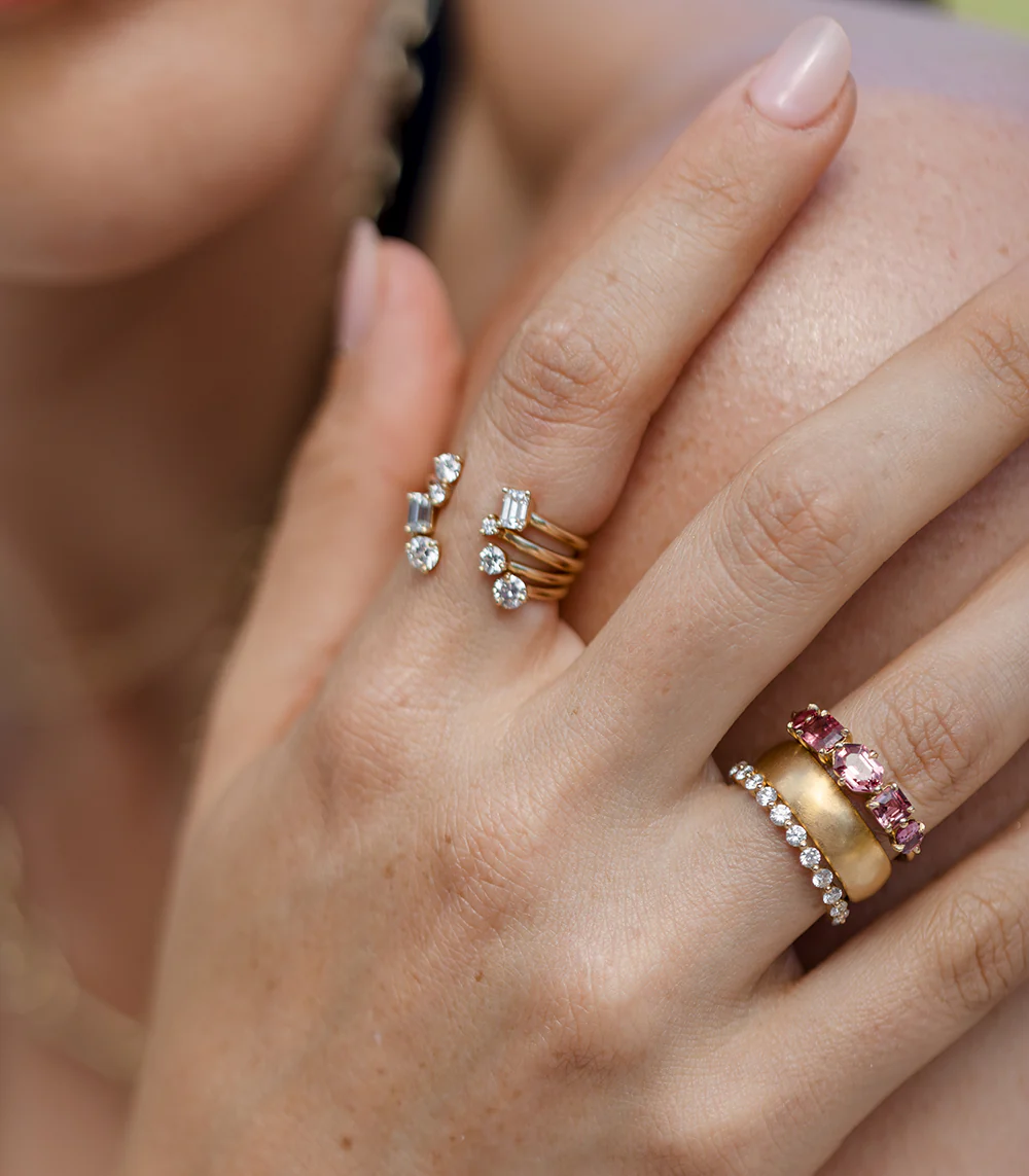Close-up of the Claudette 5-Stone Oval Hot Pink Spinel Ring, highlighting the vibrant pink spinels and the sleek 14K yellow gold band.