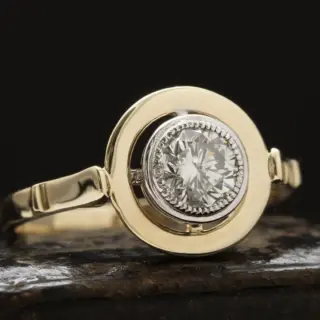 Two-tone gold ring with old European cut diamond, milgrain bezel and crosshair setting.
