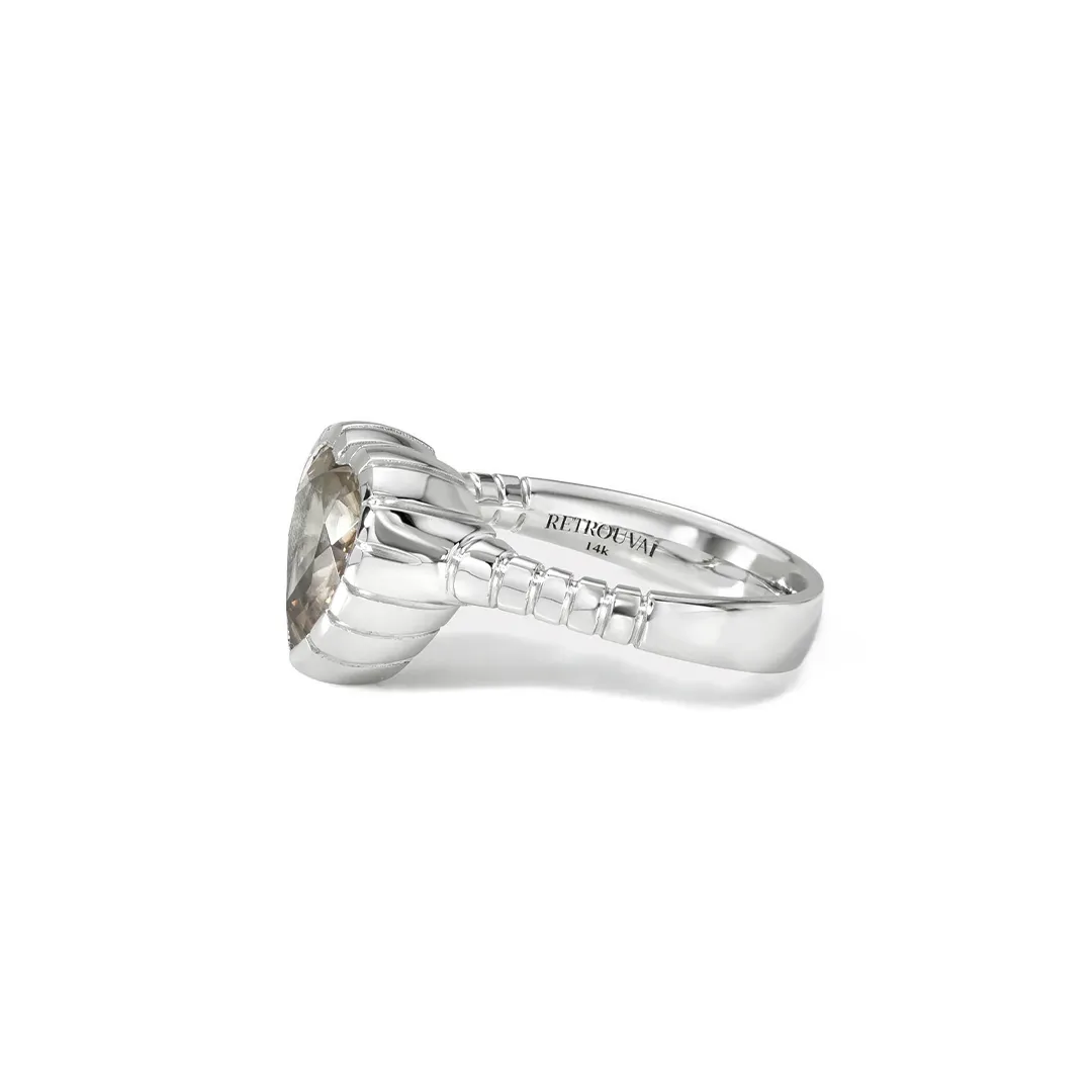Retrouvai one‑of‑a‑kind heirloom ring featuring a 4.2 ct heart grey sapphire in signature grooved bezel, white gold band