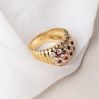 Bondeye Jewelry Royal Ring in 14K yellow gold with ribbed band, alternating checkerboard of cabochon rubies and brilliant-cut diamonds totaling 0.65 ctw.