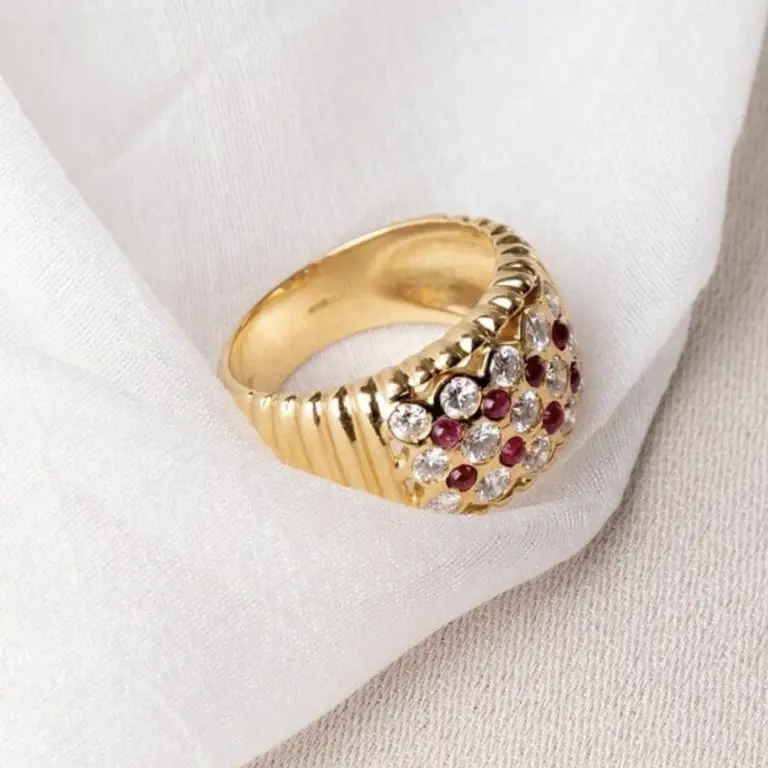 Bondeye Jewelry Royal Ring in 14K yellow gold with ribbed band, alternating checkerboard of cabochon rubies and brilliant-cut diamonds totaling 0.65 ctw.