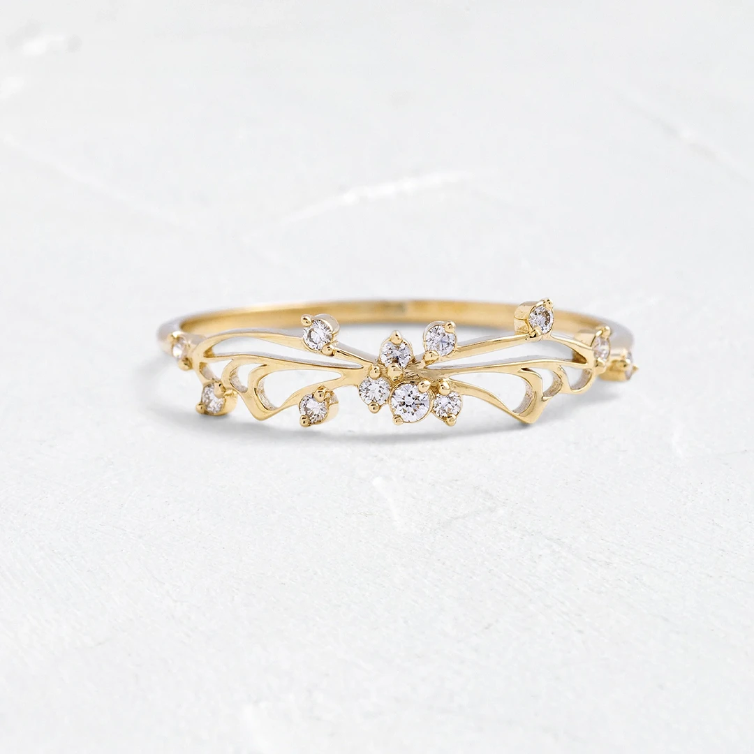 Diamond Small Changes Ring in 14k gold featuring delicate negative‑space swoops and twelve accent round diamonds (1–1.5 mm), evoking butterfly wing arches and artistic fluidity