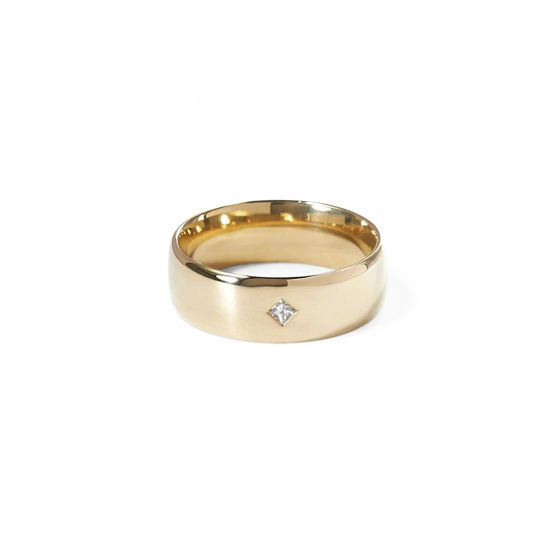 WWAKE Row Ring No. 4 — 14 k Fairmined yellow gold band, 7 mm wide domed profile with flush‑set princess‑cut diamond (0.04 ct reclaimed).