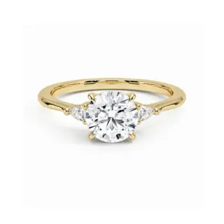 Aria three-stone engagement ring in 18k yellow gold with 1 carat round lab-grown diamond and pear-shaped side stones.