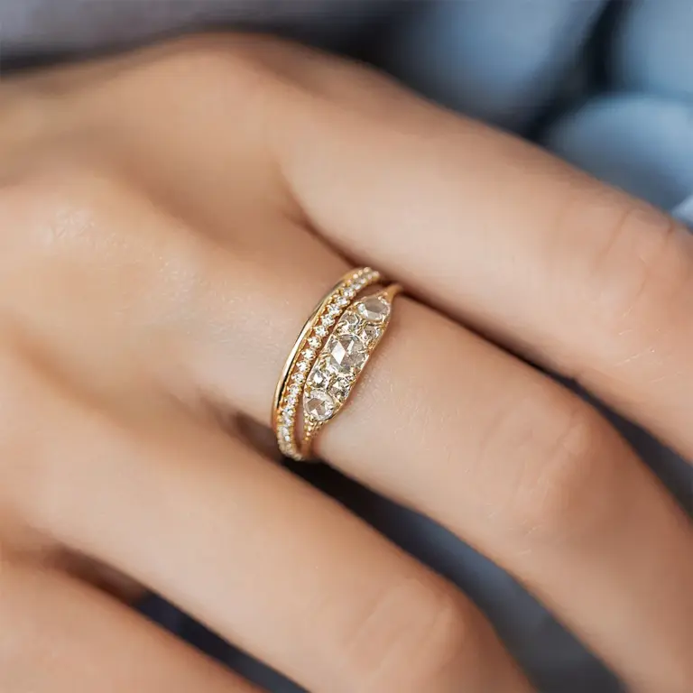 Vintage-style Overture Ring featuring seven rose cut diamonds in a 14k gold band, designed by Melanie Casey
