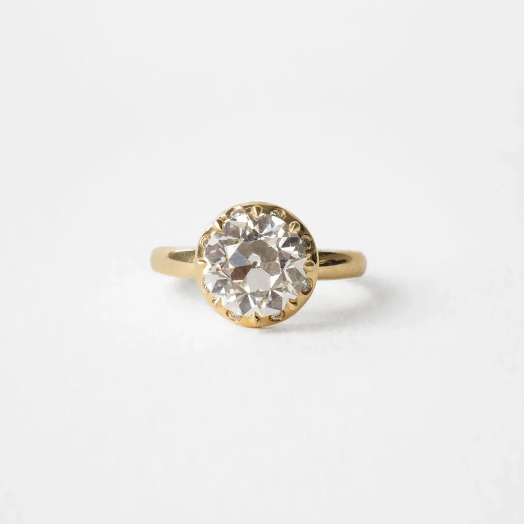 Side profile of the Arden Euro Cut ring highlighting the sculptural claw prongs and thickness of the halo surrounding the Euro‑cut center.