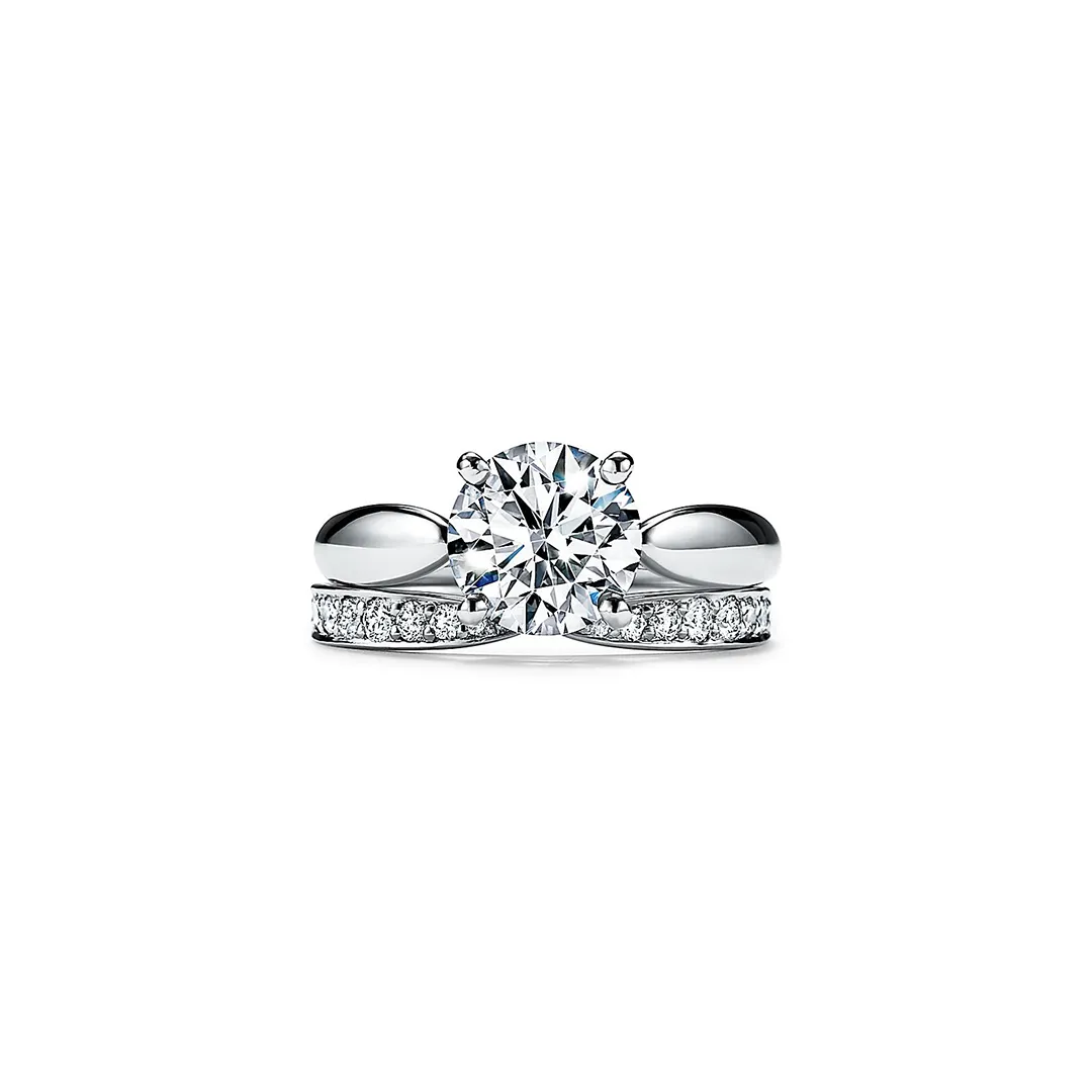 Side profile of the Tiffany Harmony® band ring highlighting the subtle taper at the center and the delicate diamond bead setting.