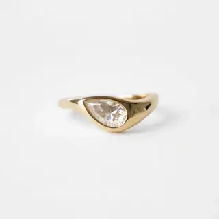 Detailed view of the Marlow East-West Pear Ring's underside, showcasing the craftsmanship and solid gold construction.