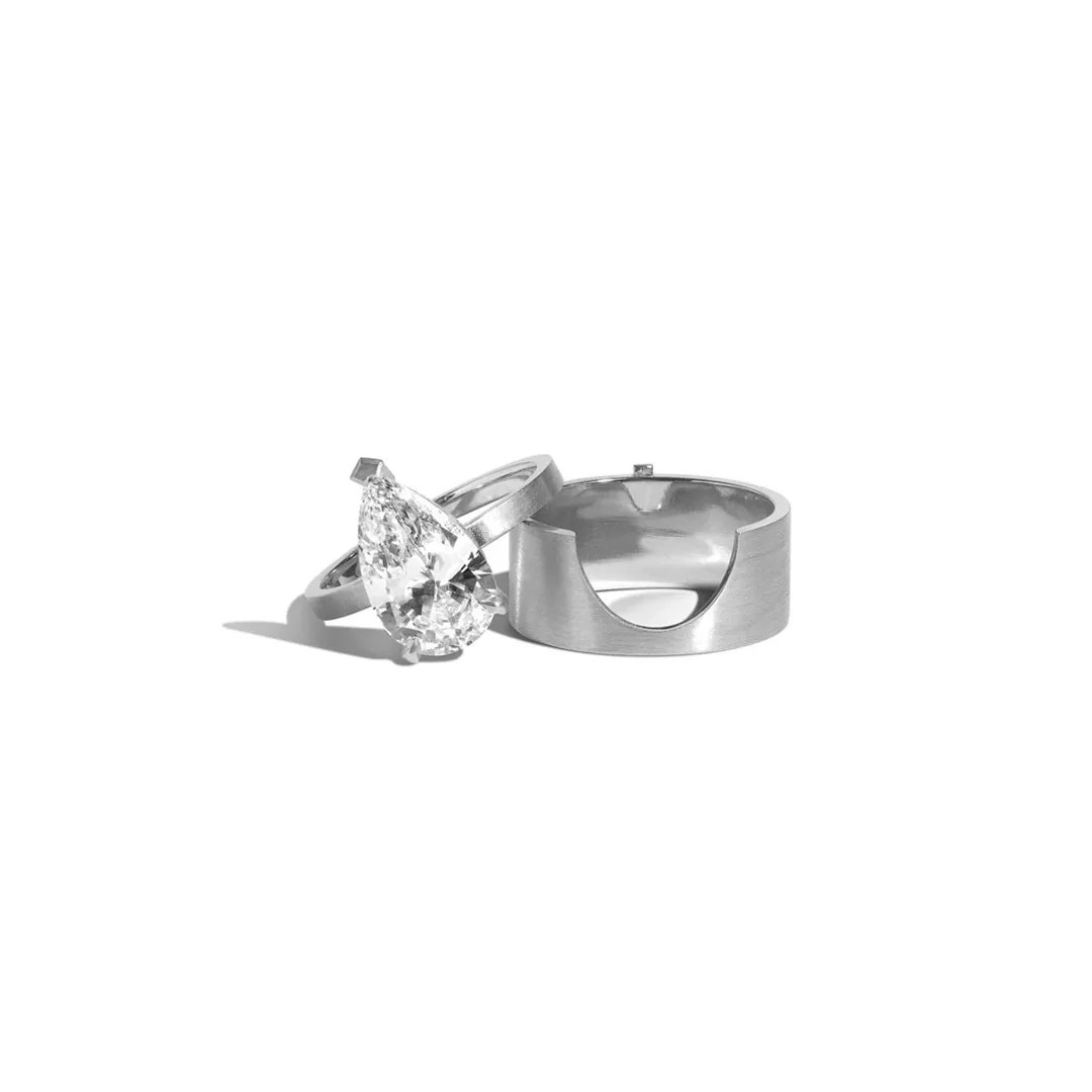 Side view of the Mid-Century Kahn Pear Ring with Cigar Band, showcasing the geometric design and negative space elements in 14K yellow gold