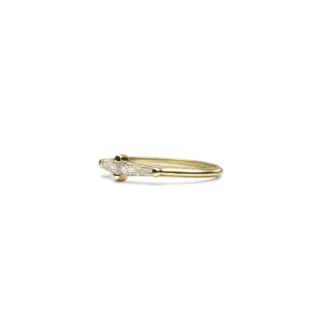 Side view of ILA’s Perryn ring, showcasing the sleek band and baguette diamond accents.