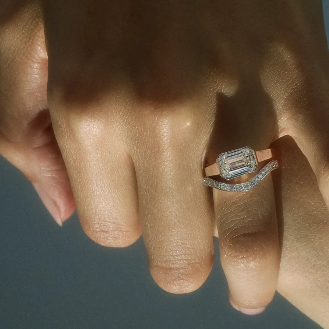Handcrafted emerald‑cut diamond Cosma Ring in platinum with minimalist octagonal bezel—emulates the stone’s silhouette