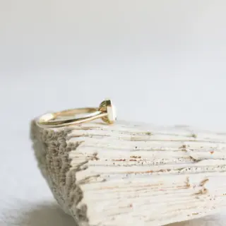 JP Gild 14 kt recycled yellow gold ring with 1.15 ct salt and pepper Asscher‑cut diamond in an open‑bottom cathedral bezel