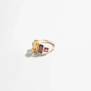 Side profile of the Path Ring highlighting its unique design and the interplay of colorful gemstones.