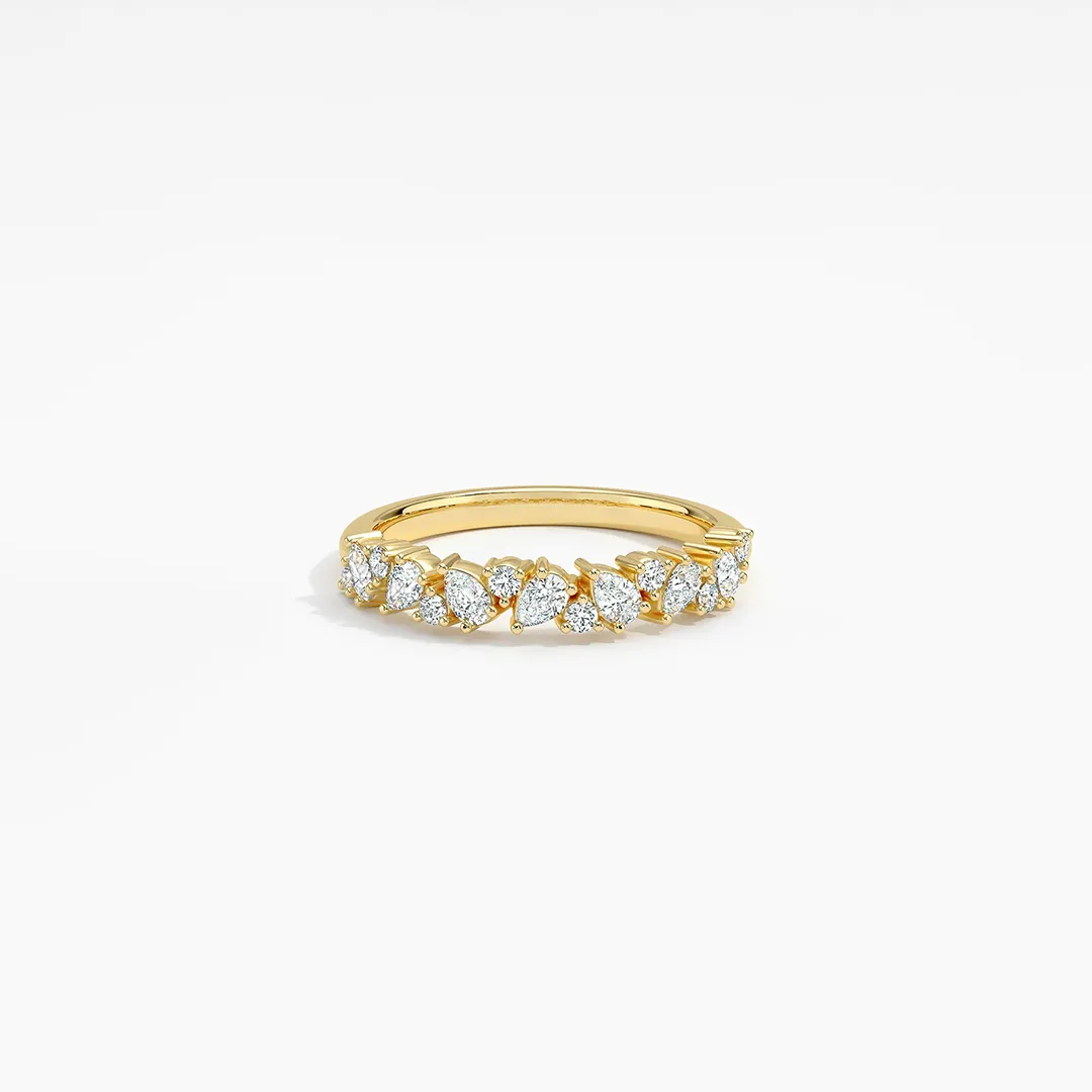 Elegant 18K white gold ring from Brilliant Earth’s Olivetta collection, featuring prong-set lab-grown round and pear diamonds that artfully glitter across the top in a half coverage design (2/5 ct tw)