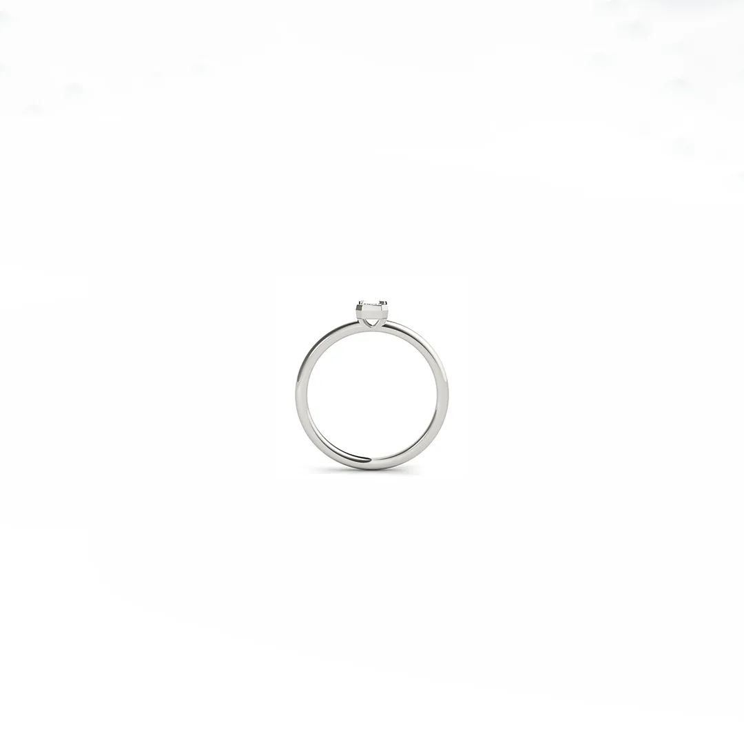 Minimalist bezel‑set lab emerald ring in 14 k white gold, stackable or solo wear, crafted by hand in New York