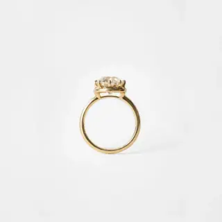 Side profile of the Arden Euro Cut ring highlighting the sculptural claw prongs and thickness of the halo surrounding the Euro‑cut center.