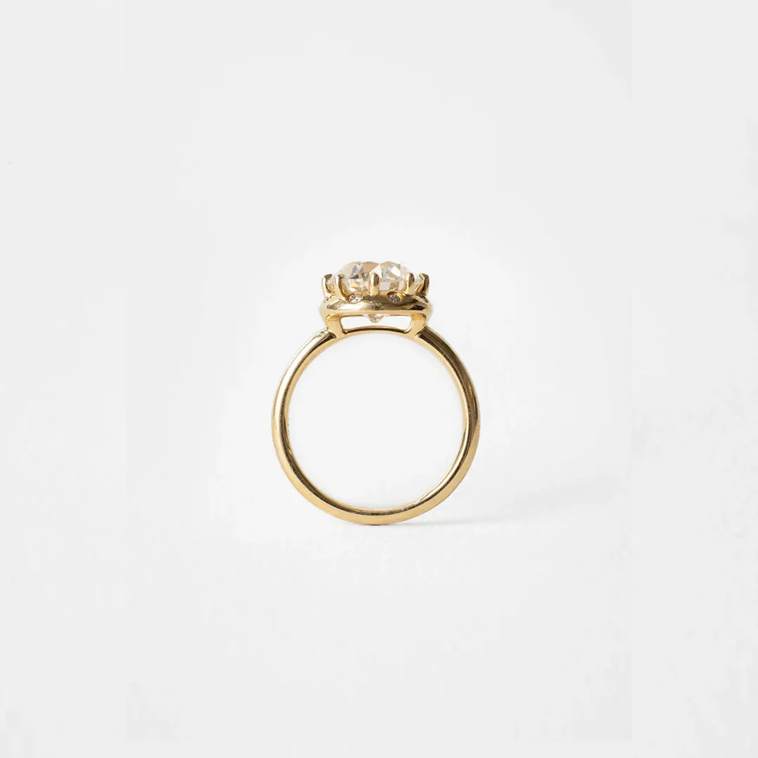 Side profile of the Arden Euro Cut ring highlighting the sculptural claw prongs and thickness of the halo surrounding the Euro‑cut center.