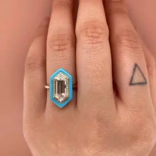 legant 14 k Yadira ring featuring white topaz, accent diamonds, and soft light‑blue enamel as a standout right‑hand or engagement ring