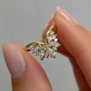 Band No. 17 by Maggi Simpkins: 18k yellow gold V-shaped band with 0.67 carats of pear, marquise, and round brilliant cut diamonds