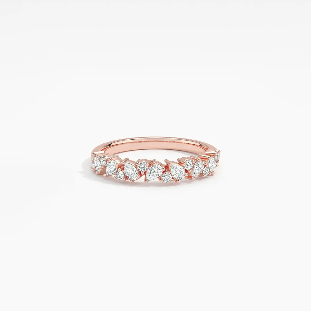 Close-up of the Olivetta Half Coverage Lab Diamond Ring in 18K white gold, showcasing a scattered pattern of round and pear-shaped lab-grown diamonds totaling approximately 0.4 carats across the top of the slender band