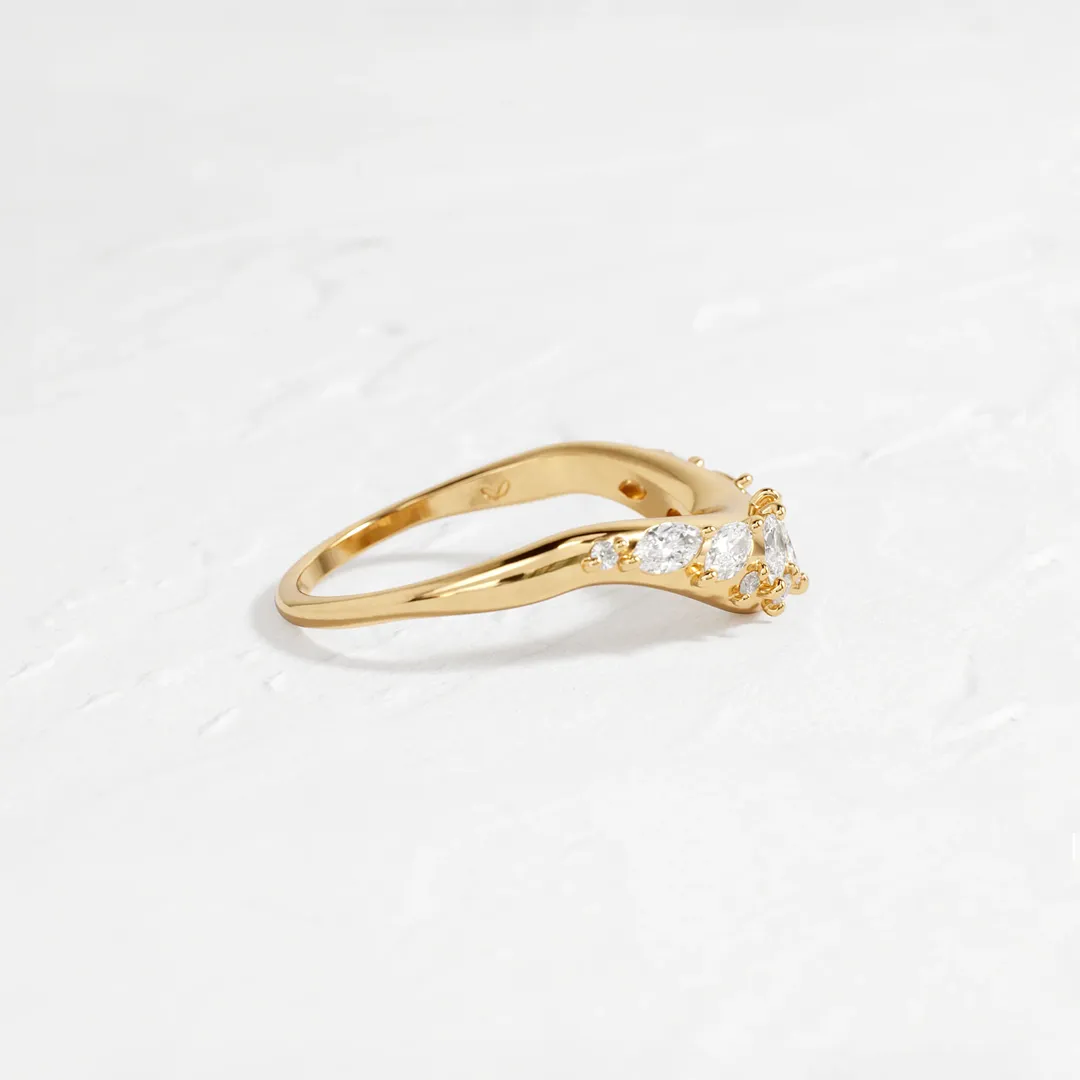 Close-up of the Amplify Band with Marquise Diamonds, showcasing seven marquise and six round diamonds set in a 14k yellow gold band.