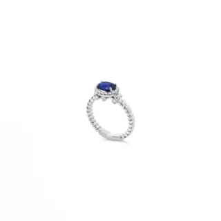 Elegant east-west set sapphire ring by Jack Kelege, 1.28ct oval sapphire and 0.32ct diamonds in 18k white gold.