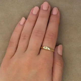 Close-up of the Yellow Sapphire Petite Risa Ring showcasing the flush-set 0.35ct oval yellow sapphire and tapered gold band.