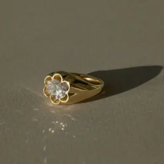 June Rings Flora East-West Oval Ring showcasing a unique petal bezel setting and domed band design